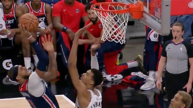 San Antonio Spurs rookie Victor Wembanyama blocks a shot from Washington Wizards center Daniel Gafford.